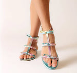 Load image into Gallery viewer, The Bow Gladiator Sandal in Rainbow Metallic
