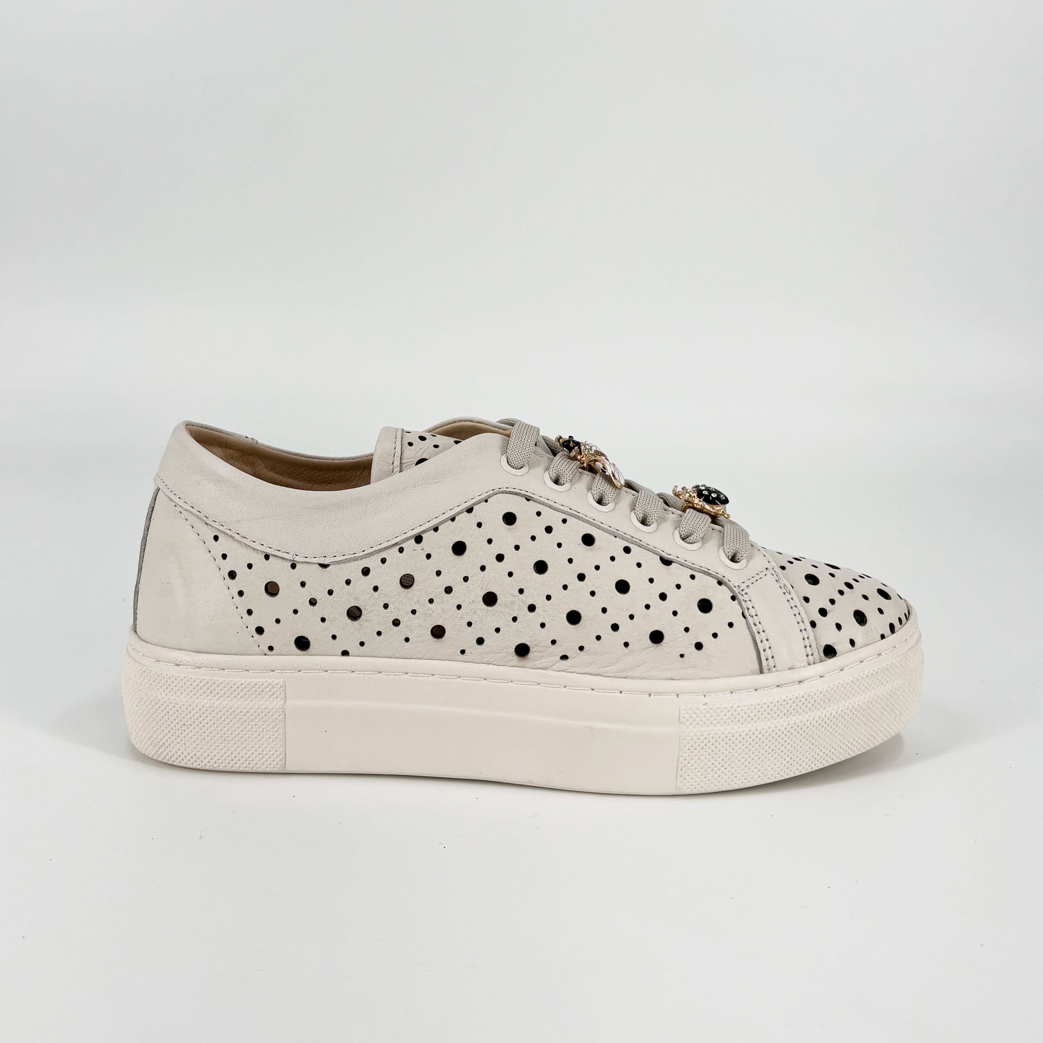 The Perforated Sneaker with Bug Ornaments in Marshmallow