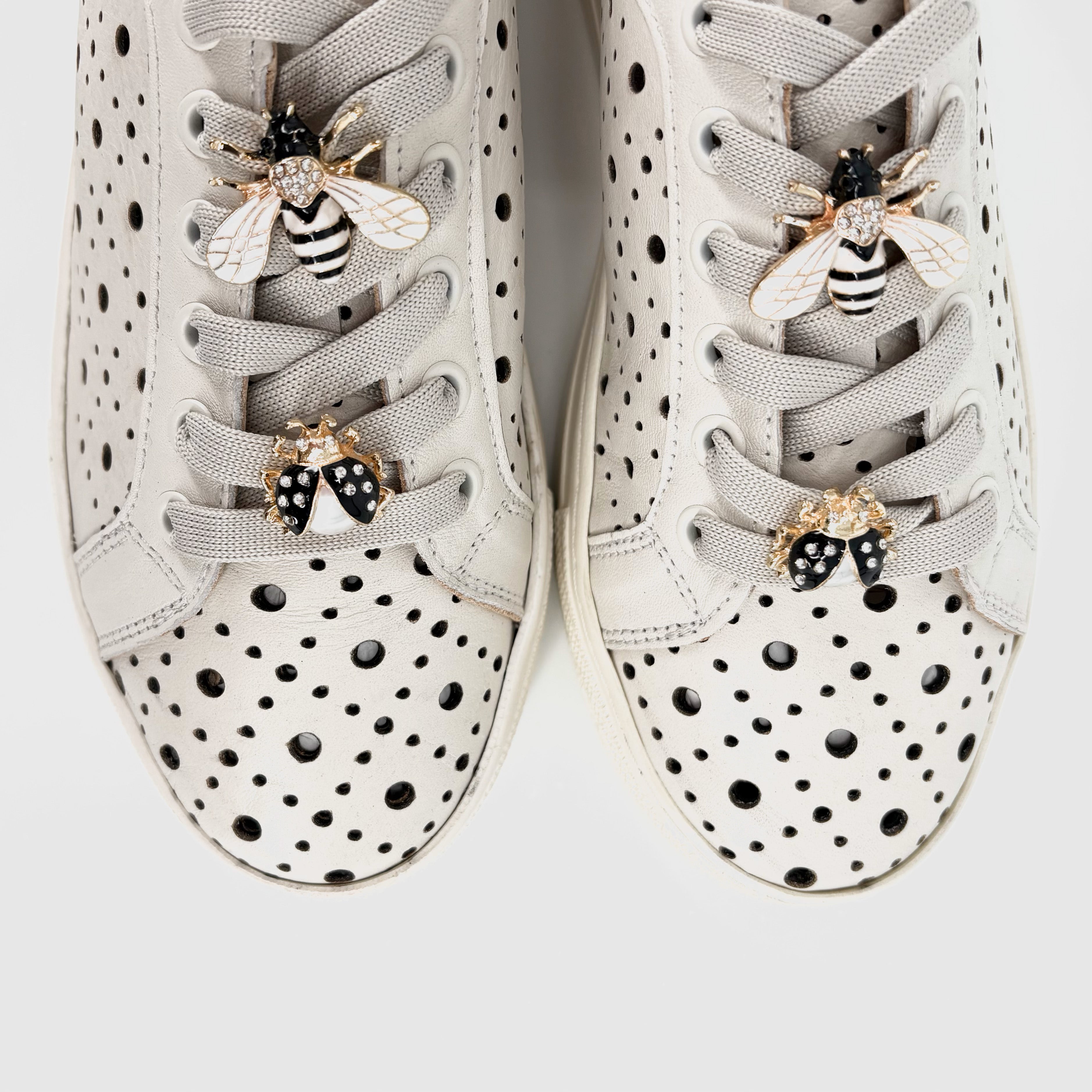 The Perforated Sneaker with Bug Ornaments in Marshmallow