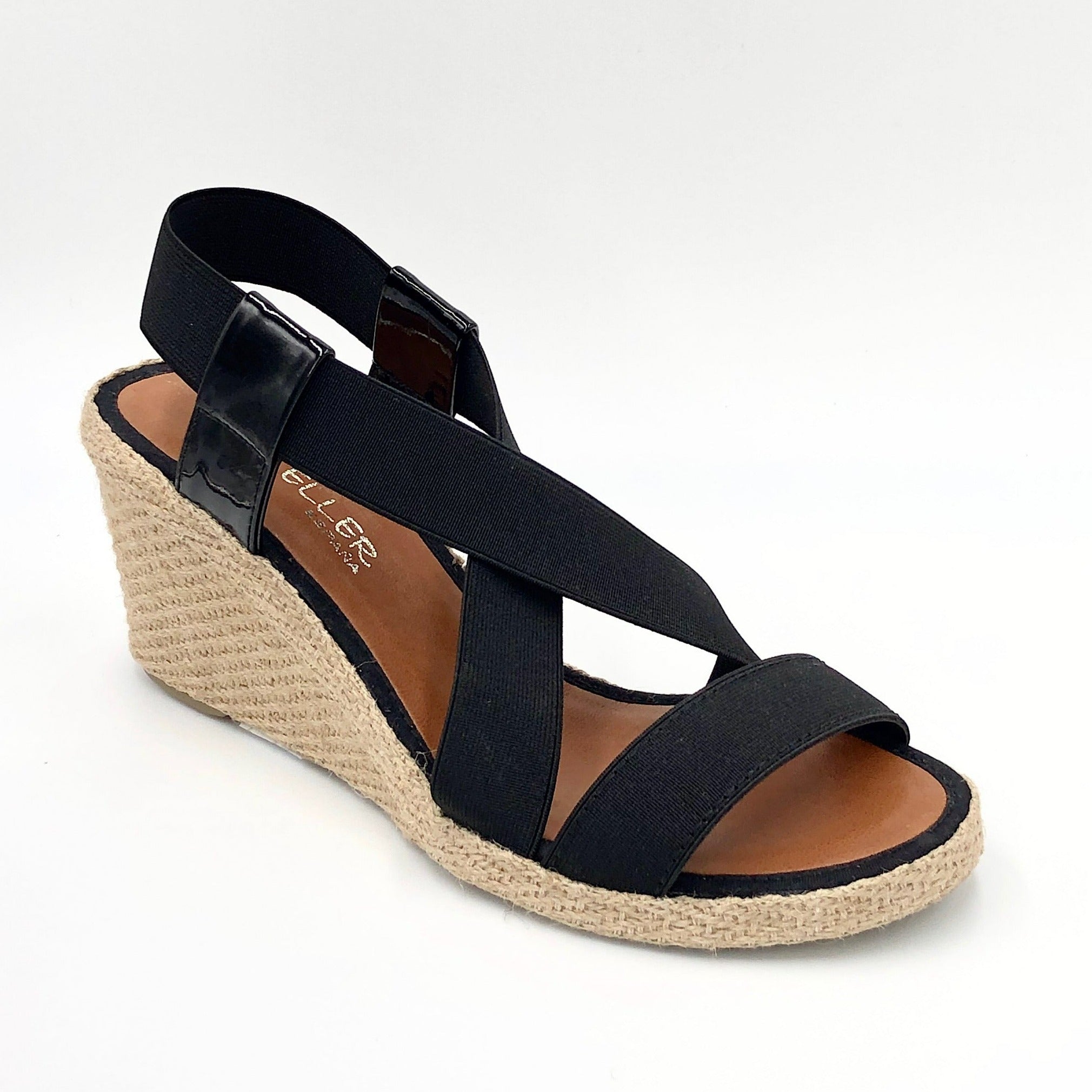 Casteller 30010 - The Elastic Espadrille Sandal in Black. Go anywhere in this classic top selling elastic espadrille on mid wedge. The elastic upper fits & flatters all types of feet and offers a great deal of comfort.