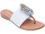 Load image into Gallery viewer, Novalee The Elastic Thong Sandal in White Slide on and go. The elastic single band with festive puff decor adds a pop of fun to any ensemble. Feel delicious all day in memory foam cushioned insoles. Walking. Lunching. Boardwalk, brunch, dinner. Easy Breezy and So Cute. Andre Assous

