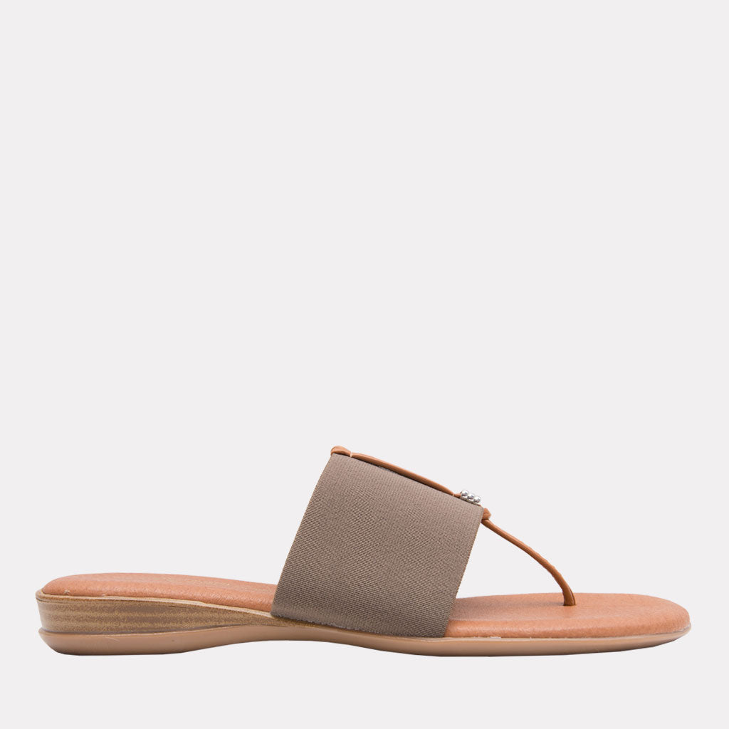 Nice - The Slide Sandal in Taupe Andre Assous Slide on and go. The single band style works with any outfit. Memory foam insoles make these as comfortable as they are easy. Walking. Lunching. Boardwalk, brunch, dinner. The lovely taupe neutral works with so much. Easy Breezy.