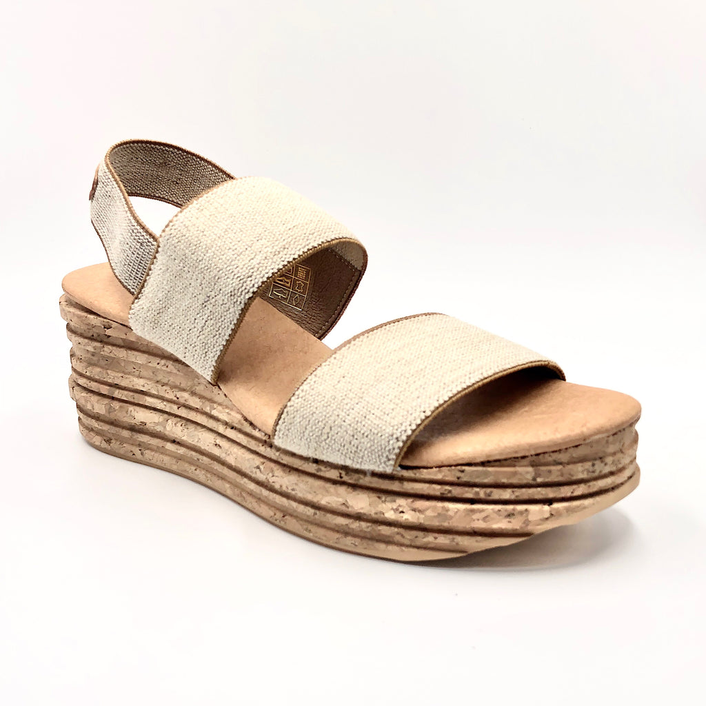 This easy elastic sandal on cork designer wedge gives you added height without the discomfort. The flatform cork wedge with padded sock lining, keeps your foot at a comfortable angle. Elastic upper, cork wedge & full rubber sole. Whole European size only. If you are a half size, larger whole size recommended.