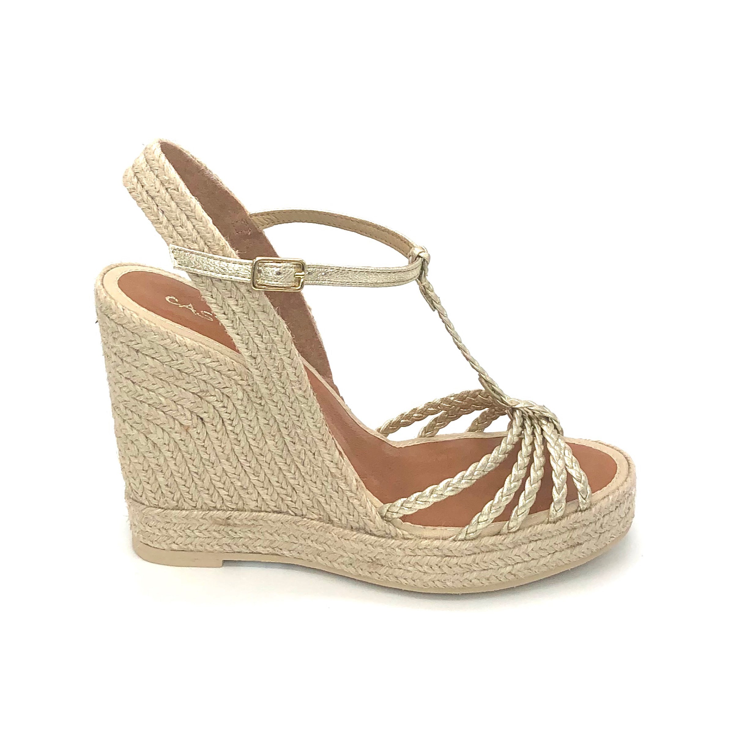 The Braided T-Strap Espadrille in Platino Metallic. This stunning multi braid t-strap sandal on high platform espadrille is a show stopper! The platino metallic thin straps instantly add hint of elegance to any outfit.